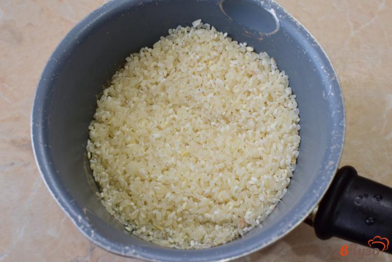 Фото приготовление рецепта: Рисовая каша с тыквой и апельсином шаг №2