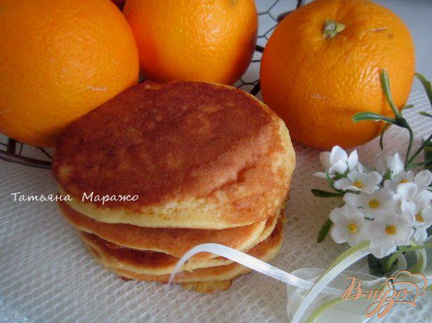фото рецепта: Апельсиновые оладьи с изюмом