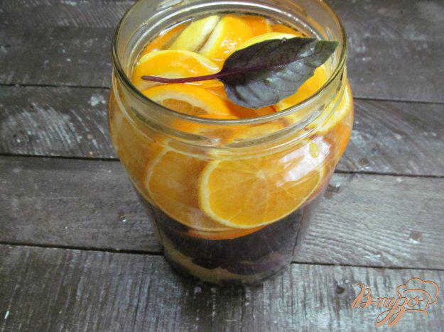 фото рецепта: Напиток из апельсина с лимоном и базиликом