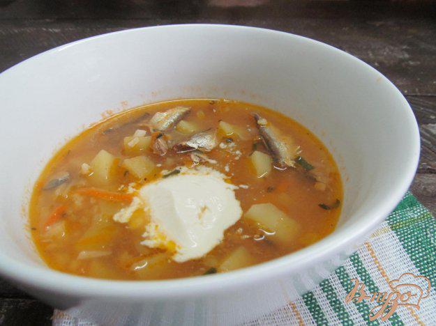 фото рецепта: Суп с килькой в томате рисом и пшеном