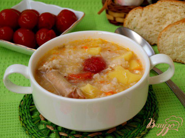фото рецепта: Куриный суп с рисом и маринованными помидорами