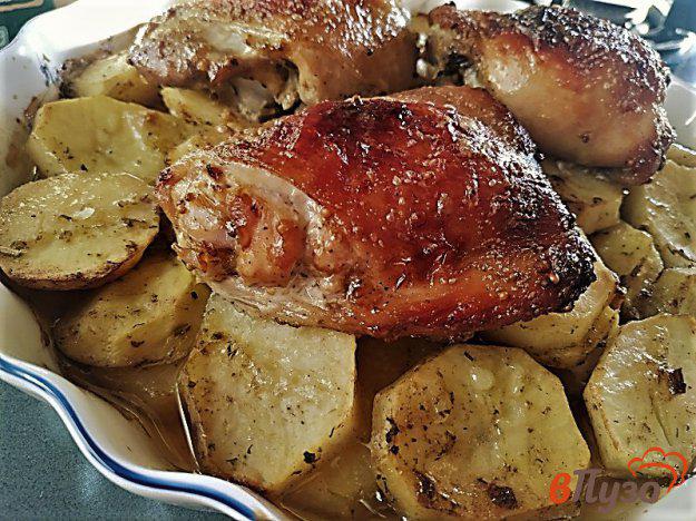 фото рецепта: Куриные бедра запеченные с картофелем