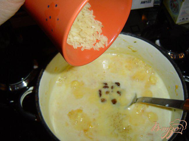 Фото приготовление рецепта: Тыквенная каша с рисом и изюмом шаг №4