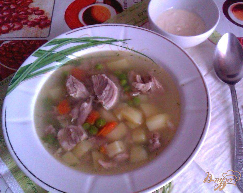 Фото приготовление рецепта: Картофельный суп со свининой и зеленым горошком шаг №7