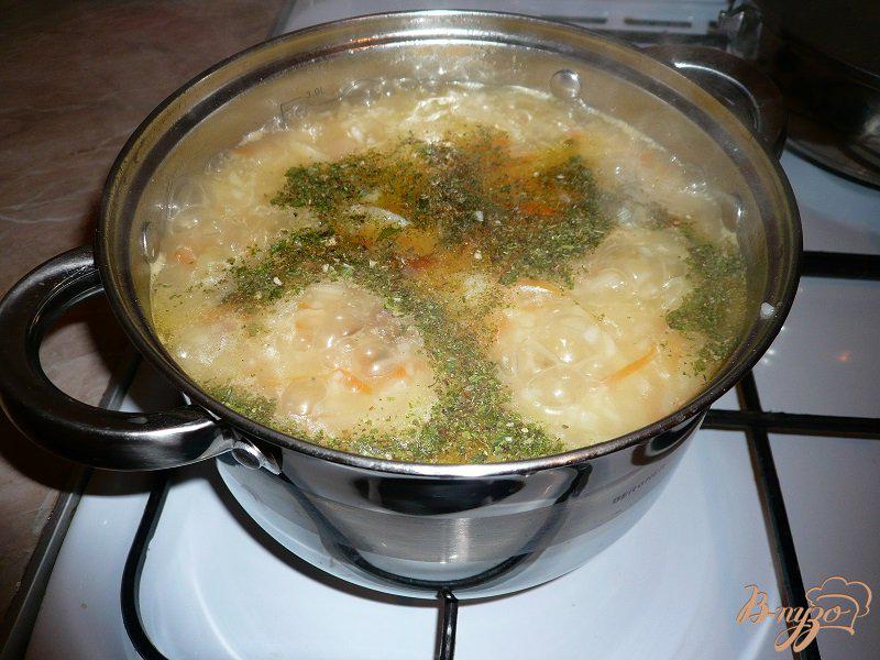 Фото приготовление рецепта: Суп с капустой и рисом шаг №8