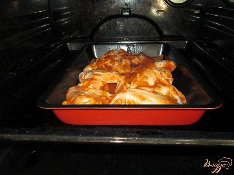 Фото приготовление рецепта: Сочные куриные крылья, запеченные в духовке шаг №6