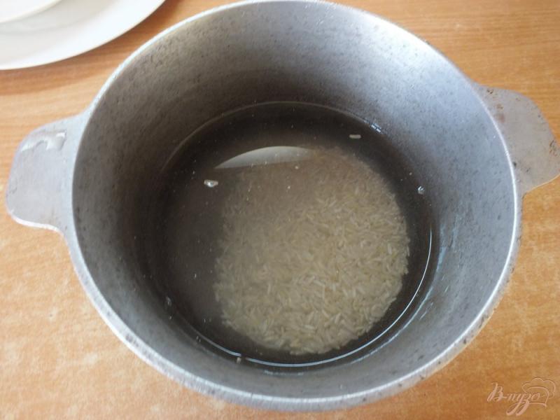 Фото приготовление рецепта: Рис неочищенный с розмарином и тимьяном шаг №2