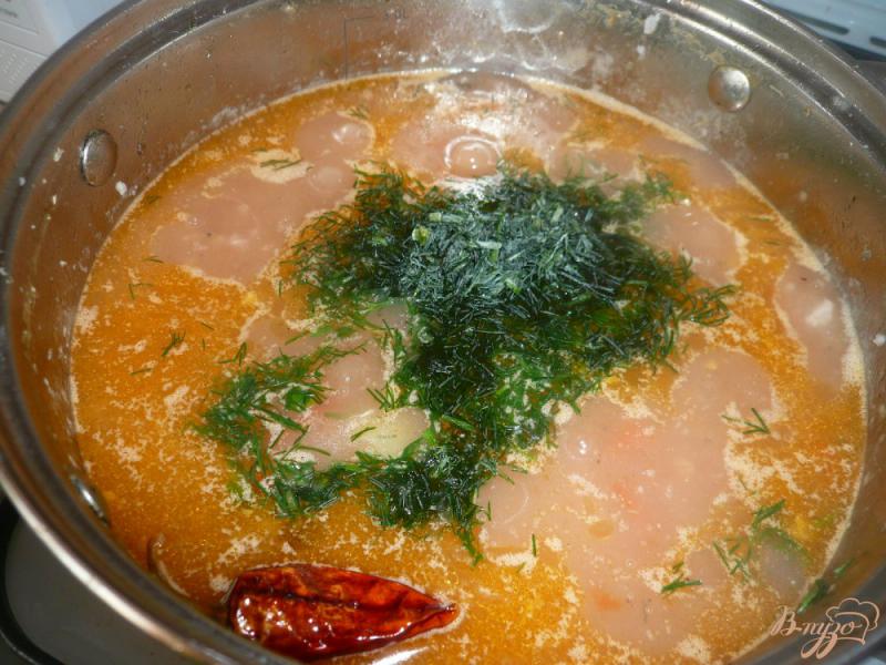 Фото приготовление рецепта: Острый рисовый суп с фасолью шаг №11