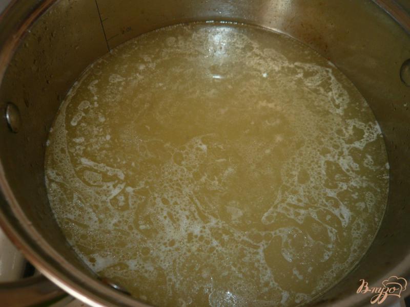 Фото приготовление рецепта: Острый рисовый суп с фасолью шаг №7