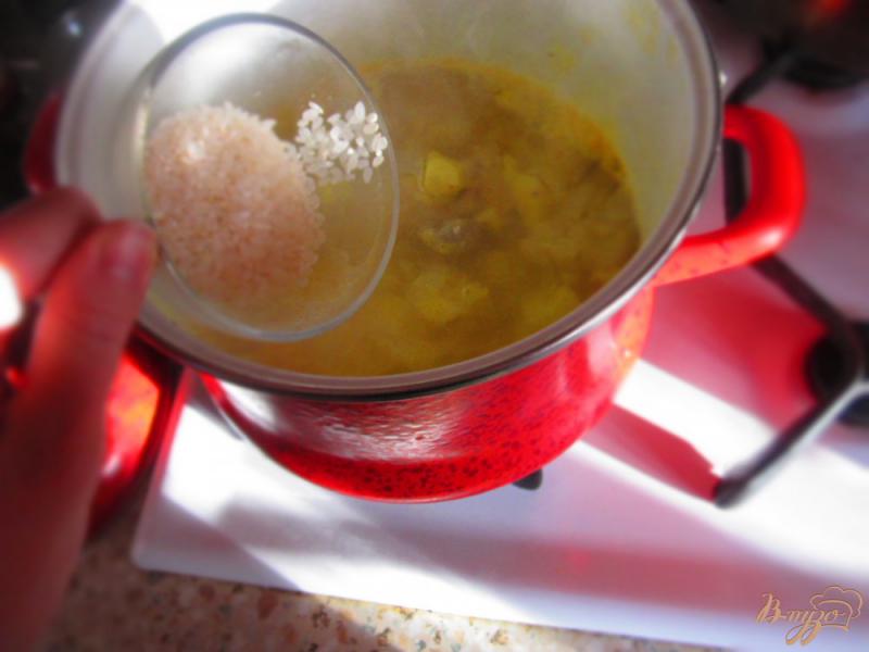 Фото приготовление рецепта: Рисовый суп с тыквой шаг №3