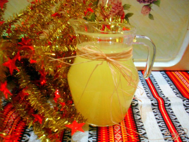 Фото приготовление рецепта: Напиток из апельсинов и лимона шаг №6