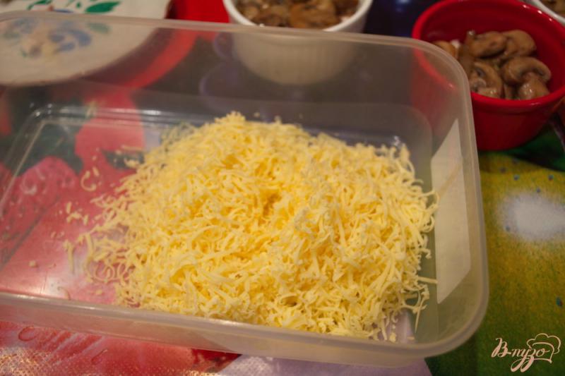 Фото приготовление рецепта: Шампиньончики со сливочной заливкой и сыром в духовке шаг №7