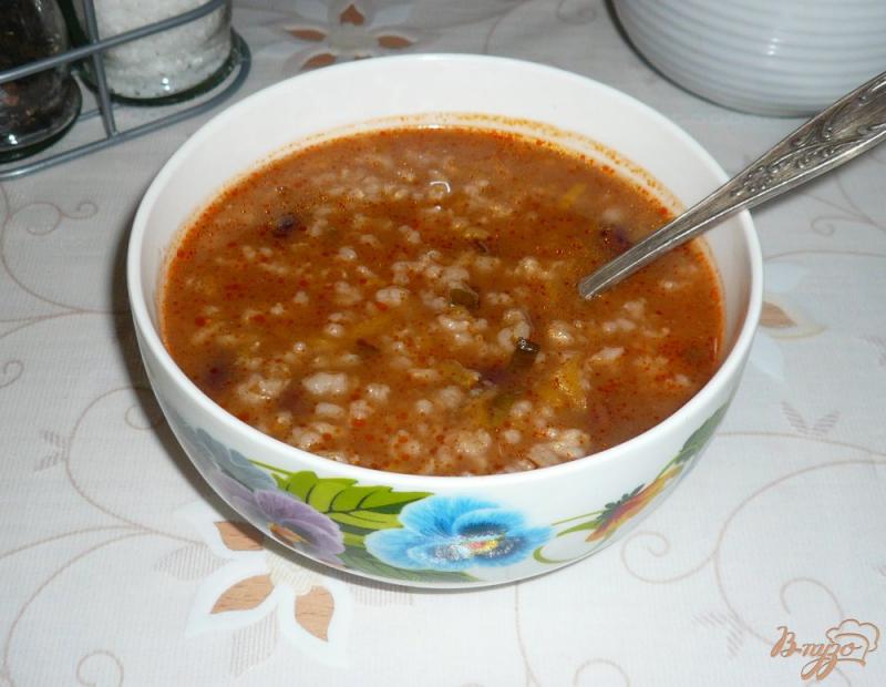 Фото приготовление рецепта: Рисовый томатный суп с фасолью шаг №9