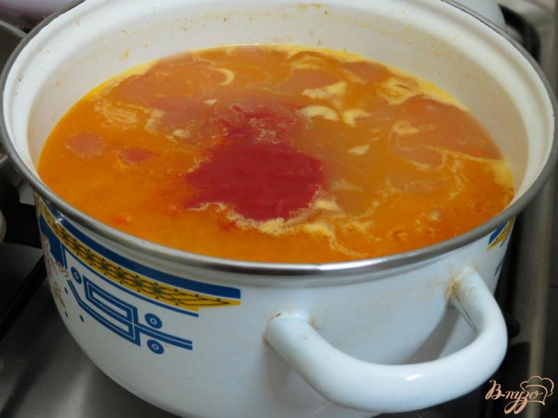 Фото приготовление рецепта: Томатный суп с рисом шаг №7