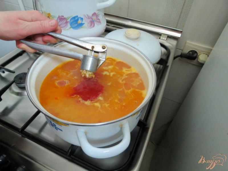 Фото приготовление рецепта: Томатный суп с рисом шаг №8