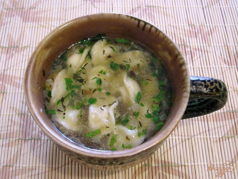 Фото приготовление рецепта: Суп с пельменями шаг №8